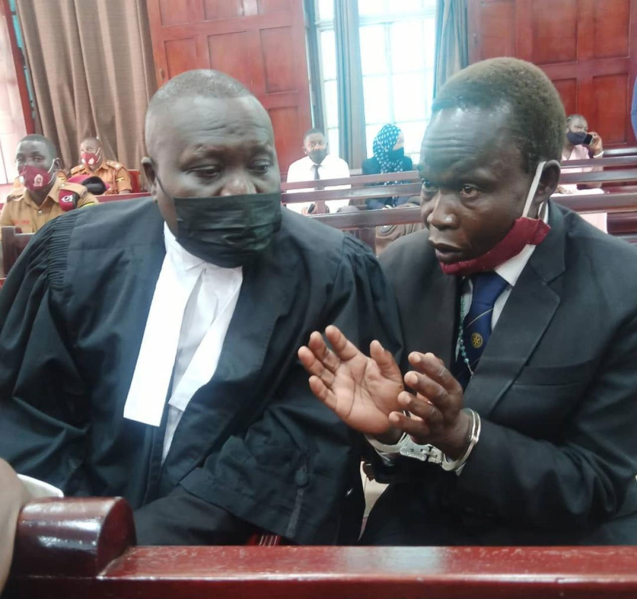 Lawyer Caleb Alaka together with the accused Thomas Kwoyelo